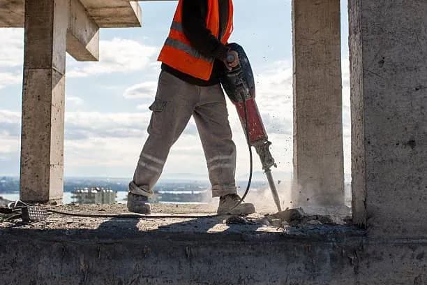 Worker operating a jackhammer